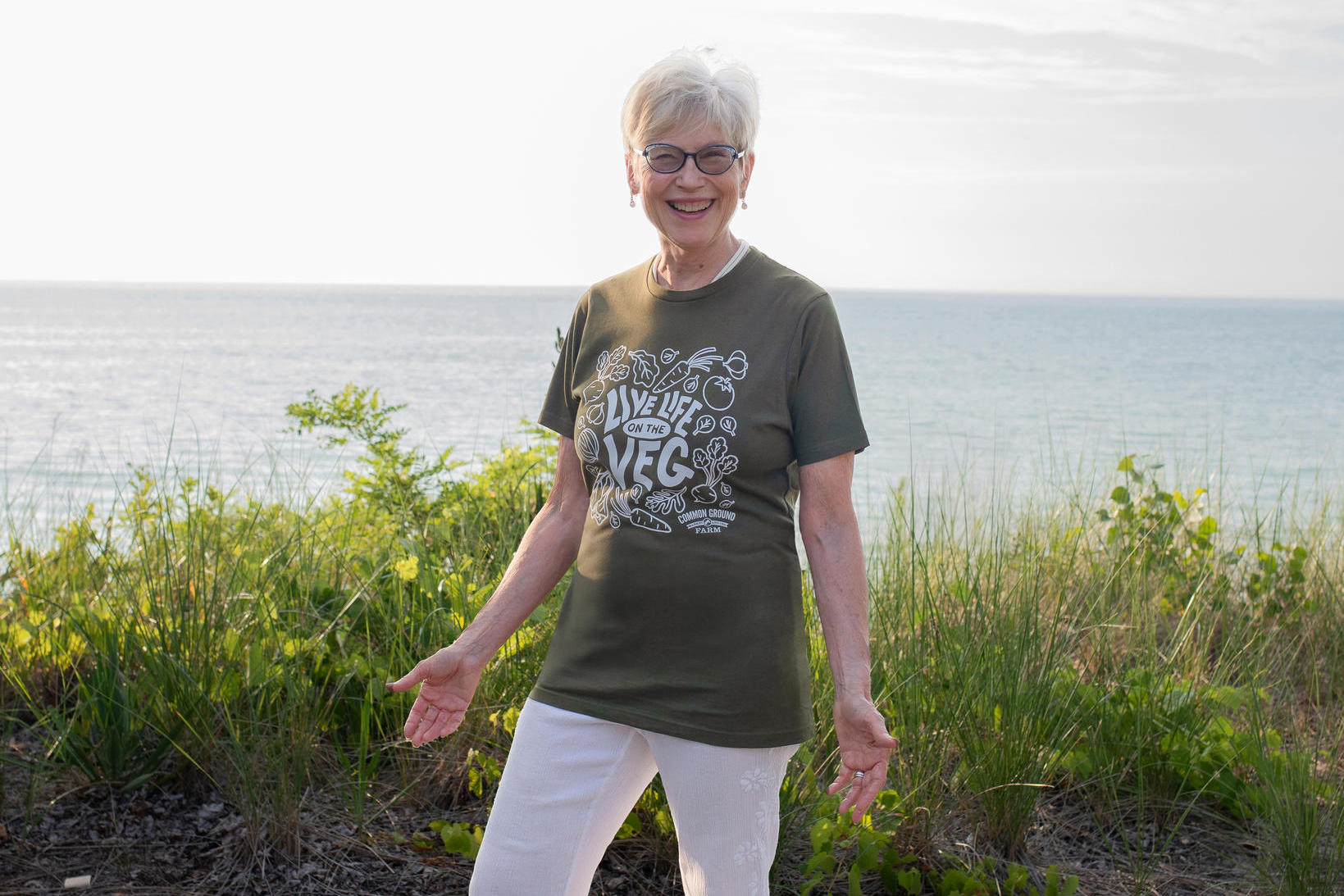 Janine Higgins wearing Live Life on the Veg T-shirt, smiling